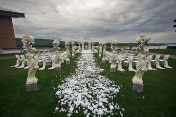 The archway and chairs on the wedding ceremony