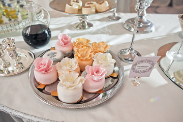 The wedding cakes on the buffet table