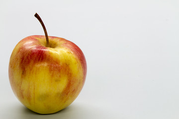 red apple on white table
