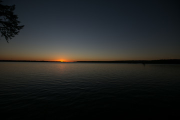 Sunset on a calm lake in Ontario Canada