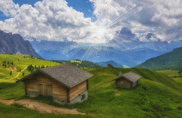 Fototapeta na wymiar Scenic view of traditional wooden alpine huts
