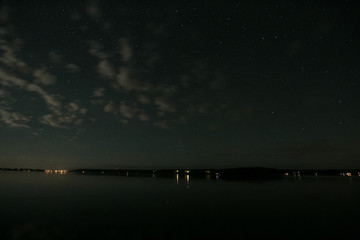 Fototapeta premium long exposure stars trees lake and sky 