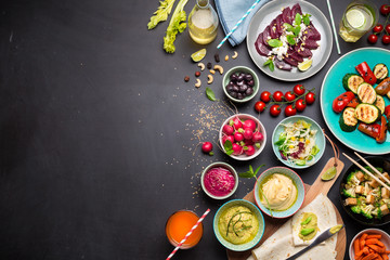 Colorful vegetarian feast dinner table from above - obrazy, fototapety, plakaty