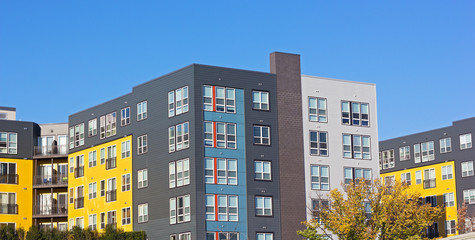 Suburban residential development of Washington DC metropolitan area. Colorful apartment building in early autumn.