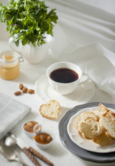 Cup of tea with biscuits and apricot jam