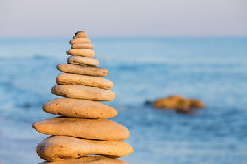 Fototapeta na wymiar Balanced stones on a beach