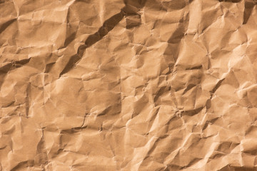 Textured background of wrinkled brown paper