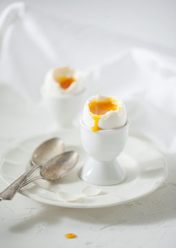 Soft boiled eggs on the white table
