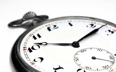 Old swiss pocket watch very close up perspective left isolated on white background