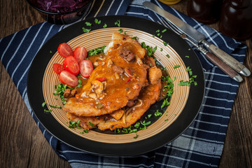Potato pancakes with meat stew served on a plate.