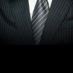 Man in suit on a black background.