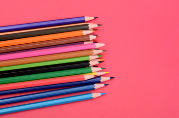 Set of Colorful Pencils on pink background