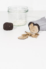 Truffle with plane and glass, white background