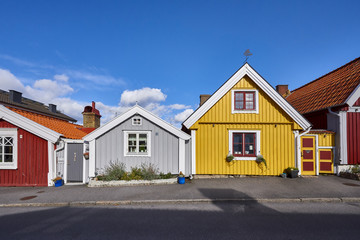 Row of ancient colorful wooden houses in the city of Karlskrona, Sweden