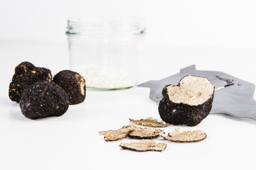Truffle with plane and glass, white background