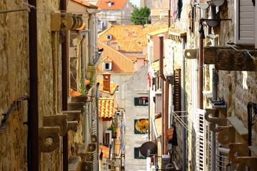 Fototapeta na wymiar Dubrovnik house roofs, view from small street