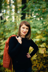 girl in a beautiful autumn forest, autumn alley