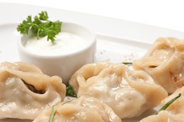 dish of ravioli with sour cream