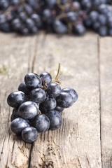 Grapes on old wooden table