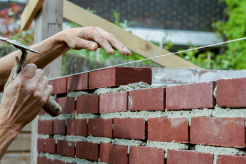 Bricklayer with trowel