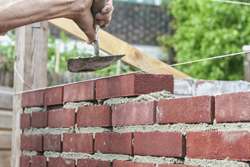 Bricklayer with trowel