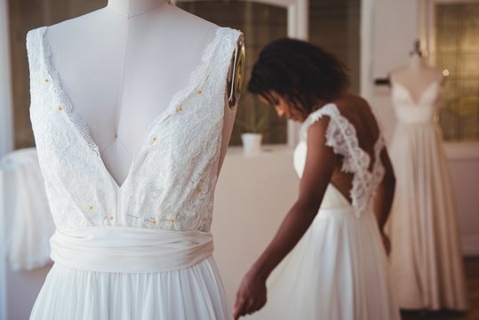 Close-up of wedding dress on mannequin