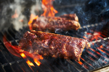 american bbq ribs cooking on grill - obrazy, fototapety, plakaty