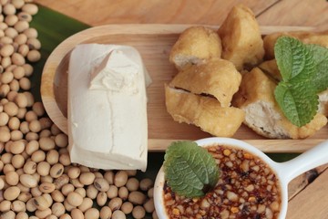 Fried tofu, chinese vegetarian food with sauce.