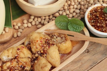 Fried tofu, chinese vegetarian food with sauce.