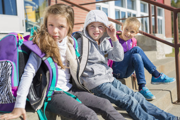 students outside school standing together