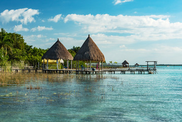 pavilion with thatched roof at laguna of bacalar
