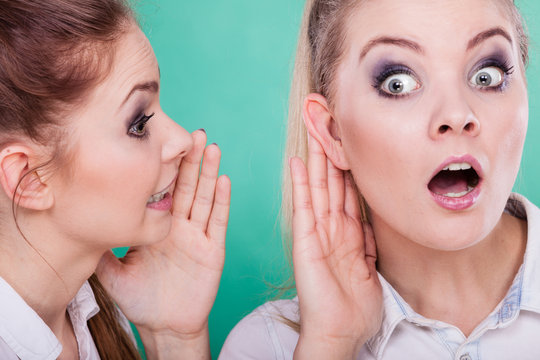 Two teenagers shares secrets, gossip