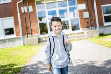 Obraz premium student outside school standing smiling