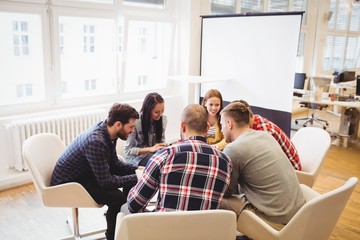 Business people discussing in meeting room 