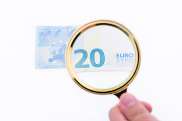 Magnifying glass with tewnty euros
