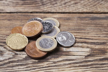 Euro coins in wood background