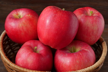 Ripe fresh red apples in a basket