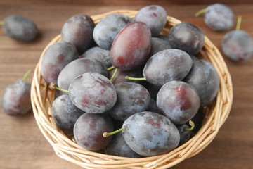 Fresh raw prunes in a basket