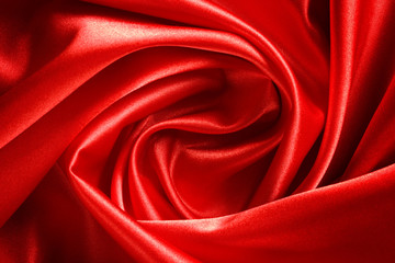 drape a bright red satin fabric in the form of roses for the bac