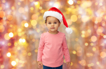 beautiful little baby girl in christmas santa hat