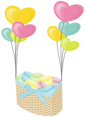 Macaroons on wicker basket with hearts balloons
