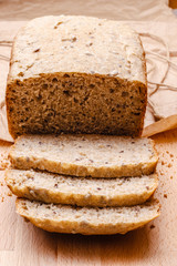 Sliced wholemeal bread on cutting board