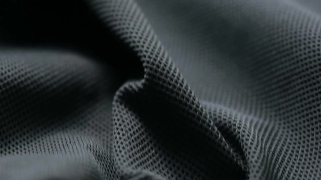 mesh cloth. black synthetic fabric. can be used as a background