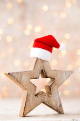 Christmas decor with angel santa hat. Vintages background.