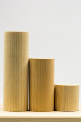 Wooden pieces with light grey background