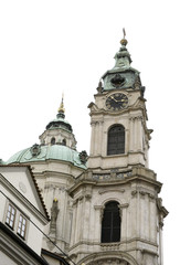 Fototapeta na wymiar The dome and clock tower of St Nicholas church in the City of Prague, Czech Republic