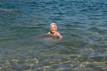Senior woman enjoying the beach