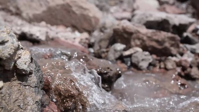 Water flowing over the rocks, mountain stream