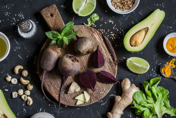 Ingredients for cooking beet and avocado detox salad. On a dark background, top view. Food...