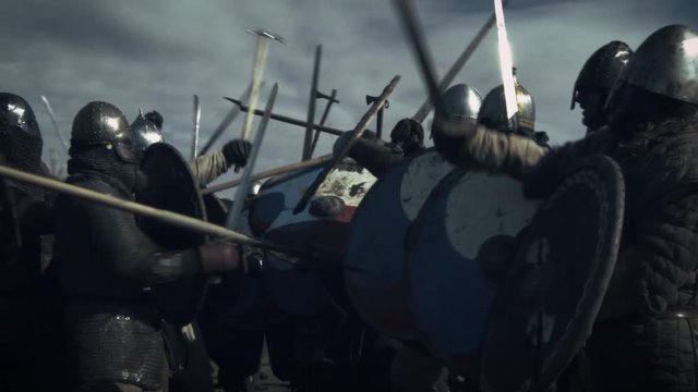 Large Battle Between Medieval Warriors. Medieval Reenactment. Shot on RED Cinema Camera in 4K (UHD).